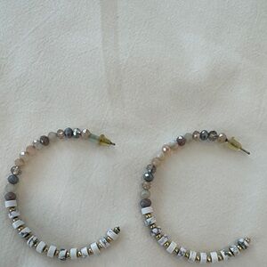 Half hoop white gold and multi pastel colored earrings.